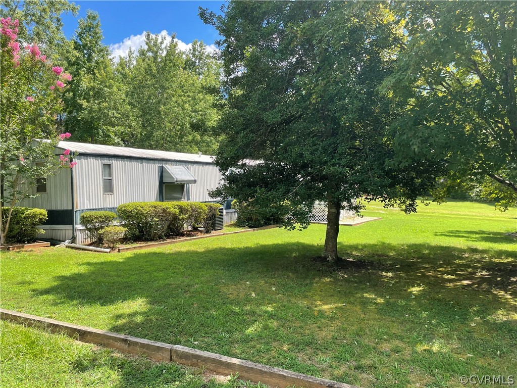 129 Locust Drive Bracey, VA 23919 - Photo 26 of 27 a view of a house with a yard