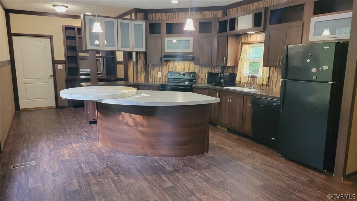 129 Locust Drive Bracey, VA 23919 - Photo 3 of 27 a kitchen with stainless steel appliances granite countertop a refrigerator a sink and a stove