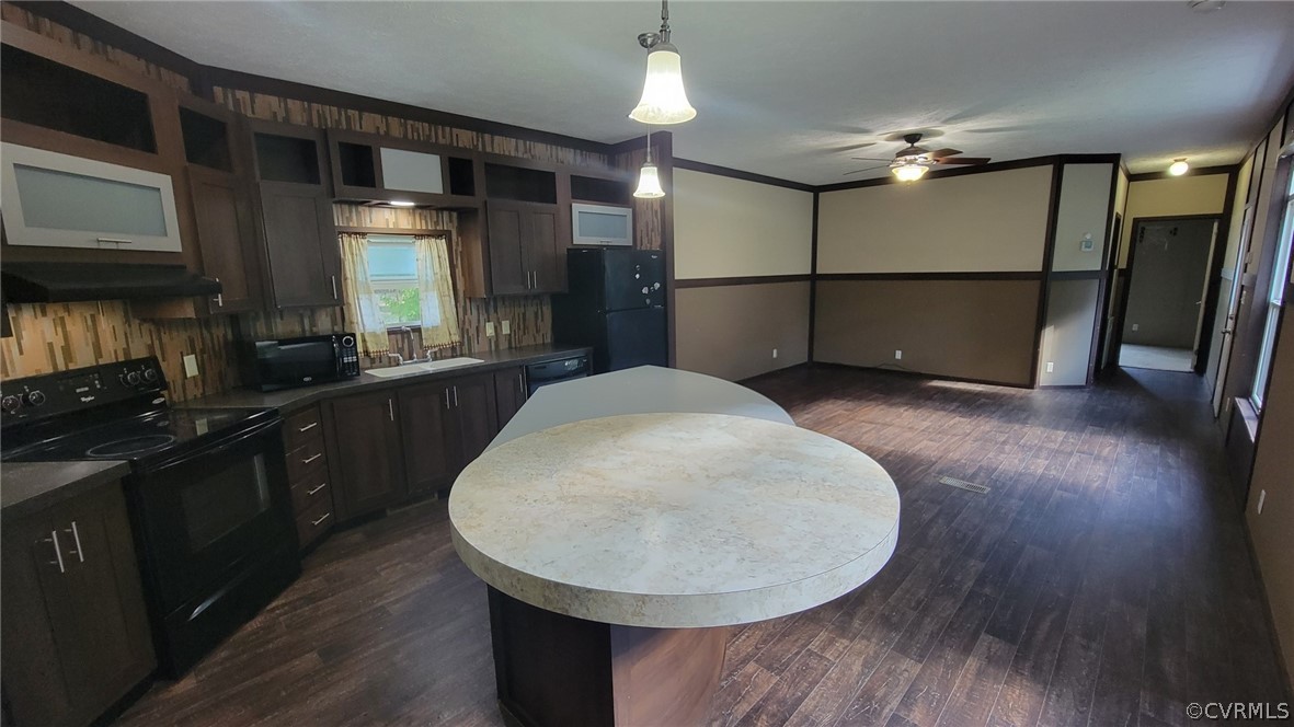 129 Locust Drive Bracey, VA 23919 - Photo 4 of 27 a kitchen with stainless steel appliances granite countertop a refrigerator a sink dishwasher a stove and a microwave oven on granite countertops