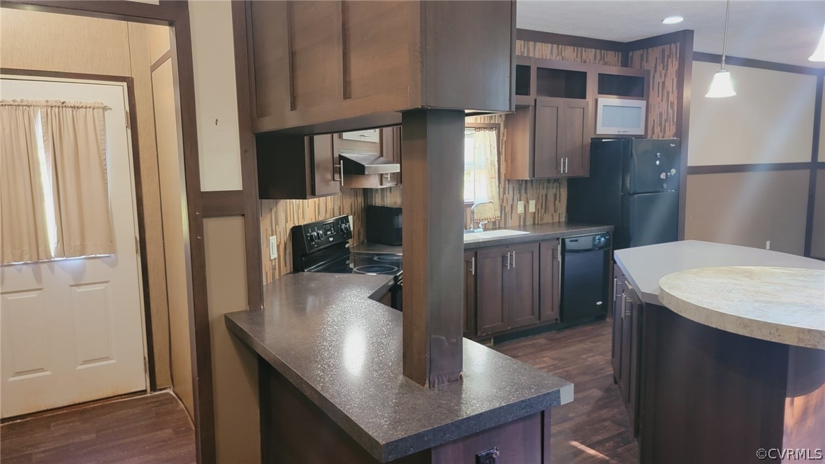 129 Locust Drive Bracey, VA 23919 - Photo 5 of 27 a kitchen with stainless steel appliances granite countertop a refrigerator a sink and a stove