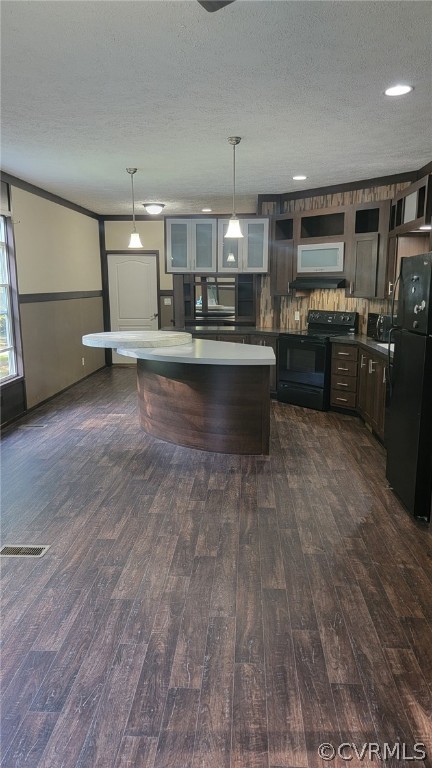 129 Locust Drive Bracey, VA 23919 - Photo 6 of 27 a large kitchen with a large counter top stainless steel appliances and cabinets