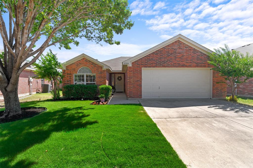 10904 Rising Mist Court Fort Worth, TX 76052 - Photo 1 of 1 a front view of a house with a yard and garage