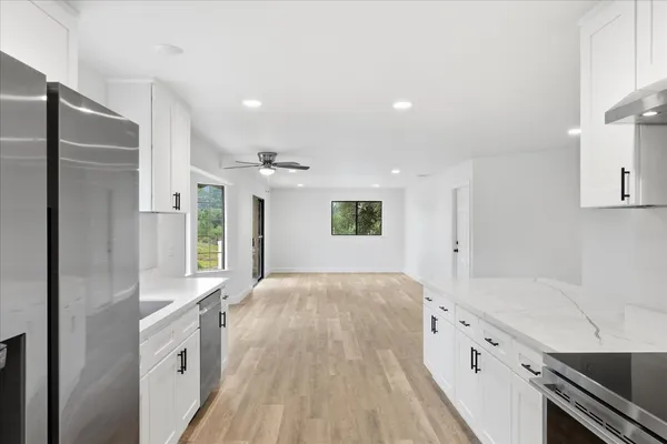 a spacious bathroom with a double vanity sink and a large mirror