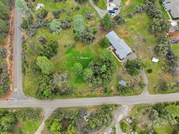 a front view of a building with a garden