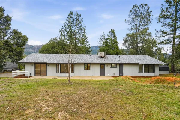 an aerial view of a house with a lake view