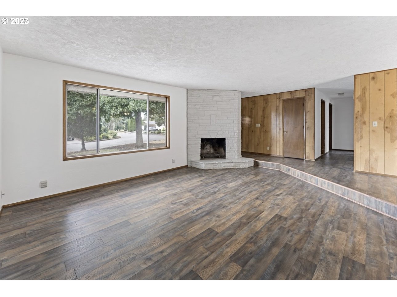 2747 32nd Street Springfield, OR 97477 - Photo 3 of 17 a view of empty room with wooden floor and fan