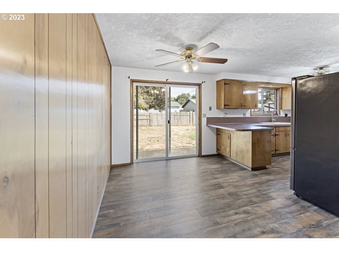 2747 32nd Street Springfield, OR 97477 - Photo 5 of 17 a view of a kitchen with a sink and wooden floor