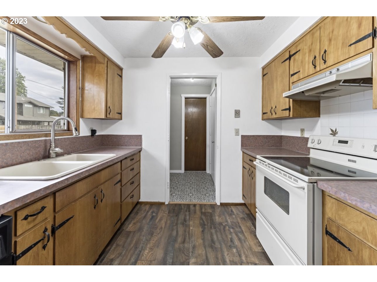 2747 32nd Street Springfield, OR 97477 - Photo 8 of 17 a kitchen with a sink cabinets and window