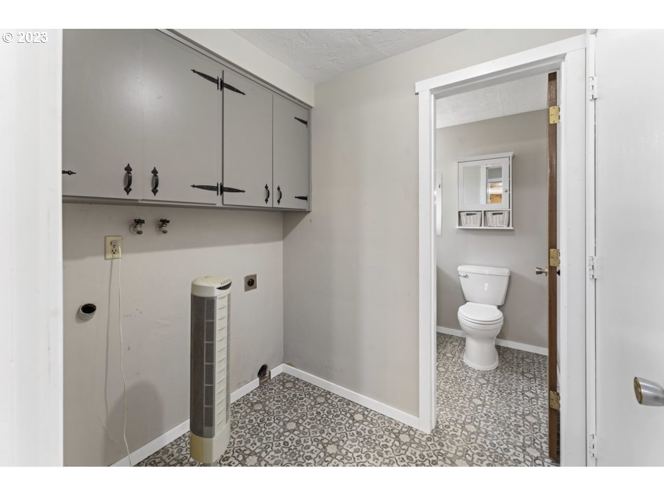 2747 32nd Street Springfield, OR 97477 - Photo 9 of 17 a bathroom with a sink a toilet and a mirror