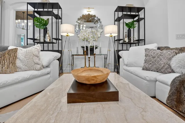 a large kitchen with granite countertop a sink and cabinets
