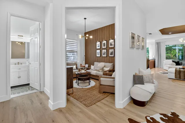 a living room with furniture and flowers