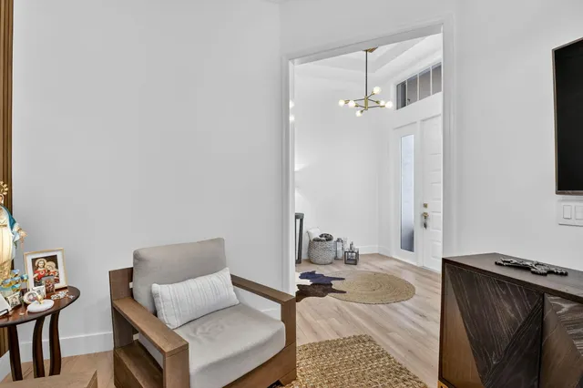 an aerial view of residential houses with outdoor space and street view