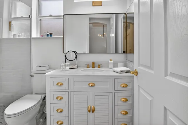 an aerial view of residential houses with outdoor space and street view