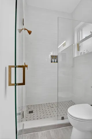 an aerial view of residential houses with outdoor space and street view