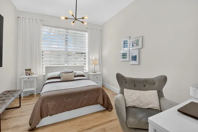 a view of a kitchen with a sink and wooden floor