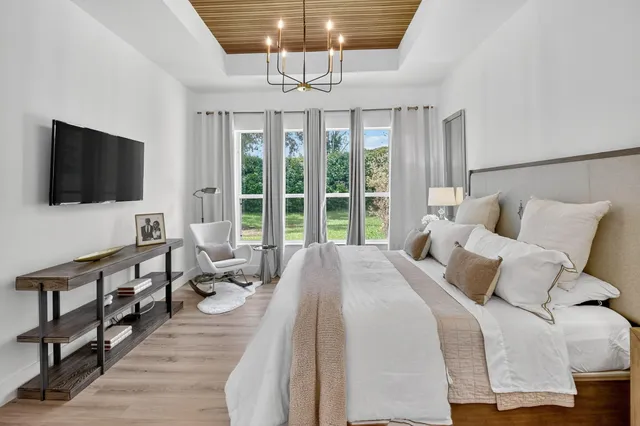 a front view of a house with a yard table and chairs