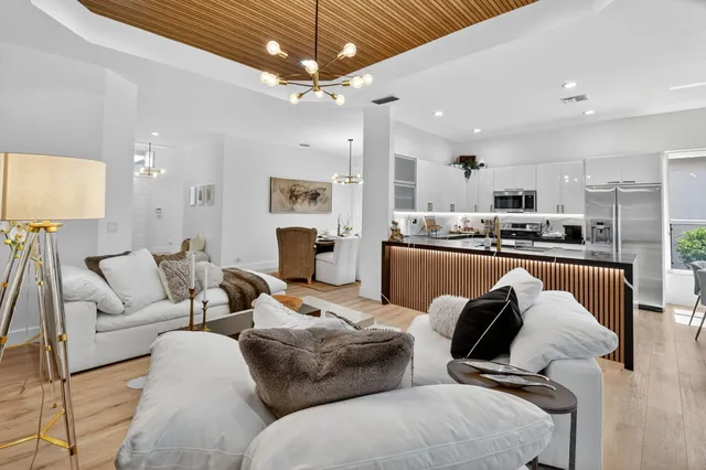 a kitchen with stainless steel appliances granite countertop a sink and stove top oven