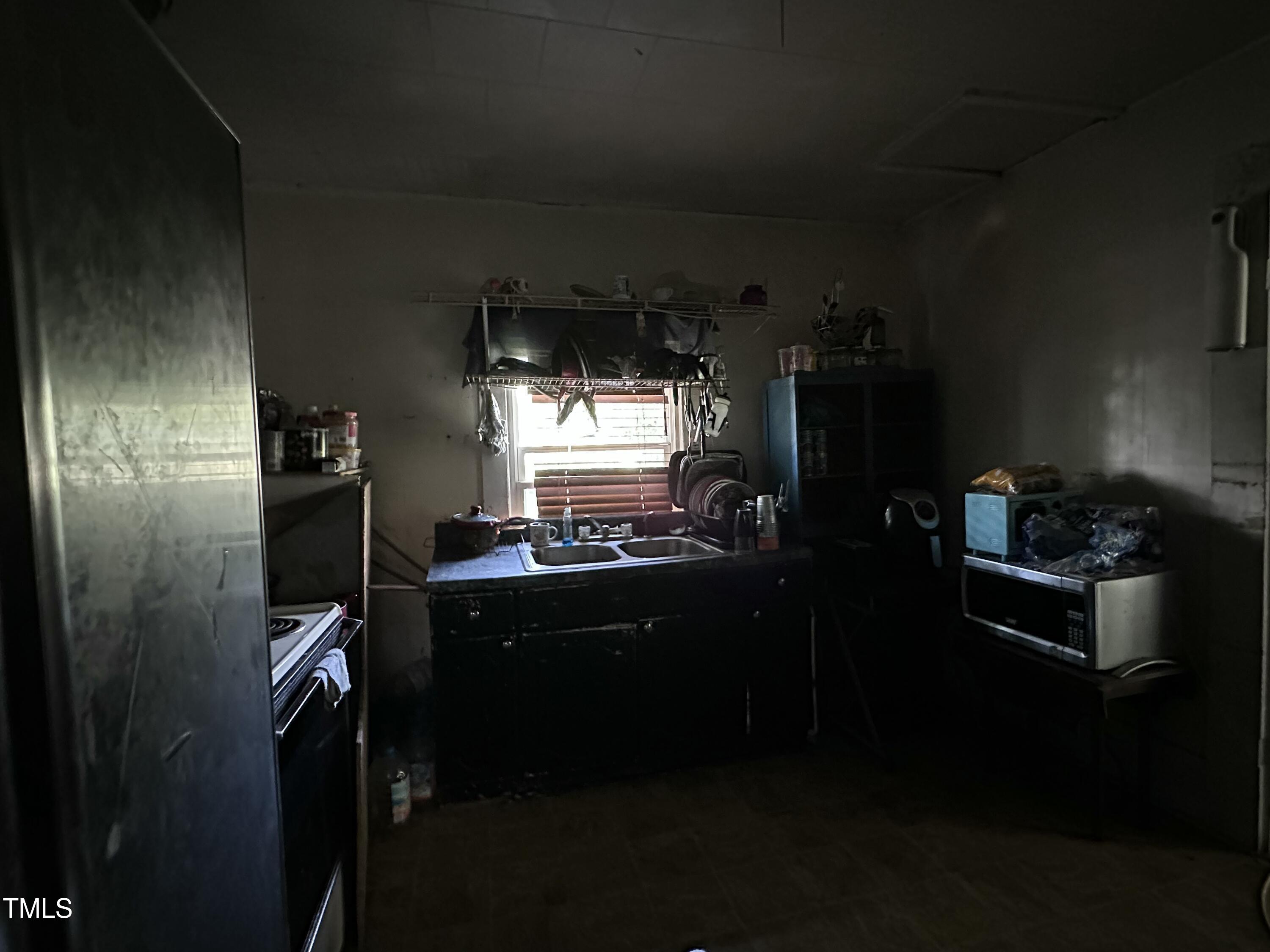 129 Spring Valley Road Henderson, NC 27536 - Photo 14 of 14 a room with furniture and chandelier