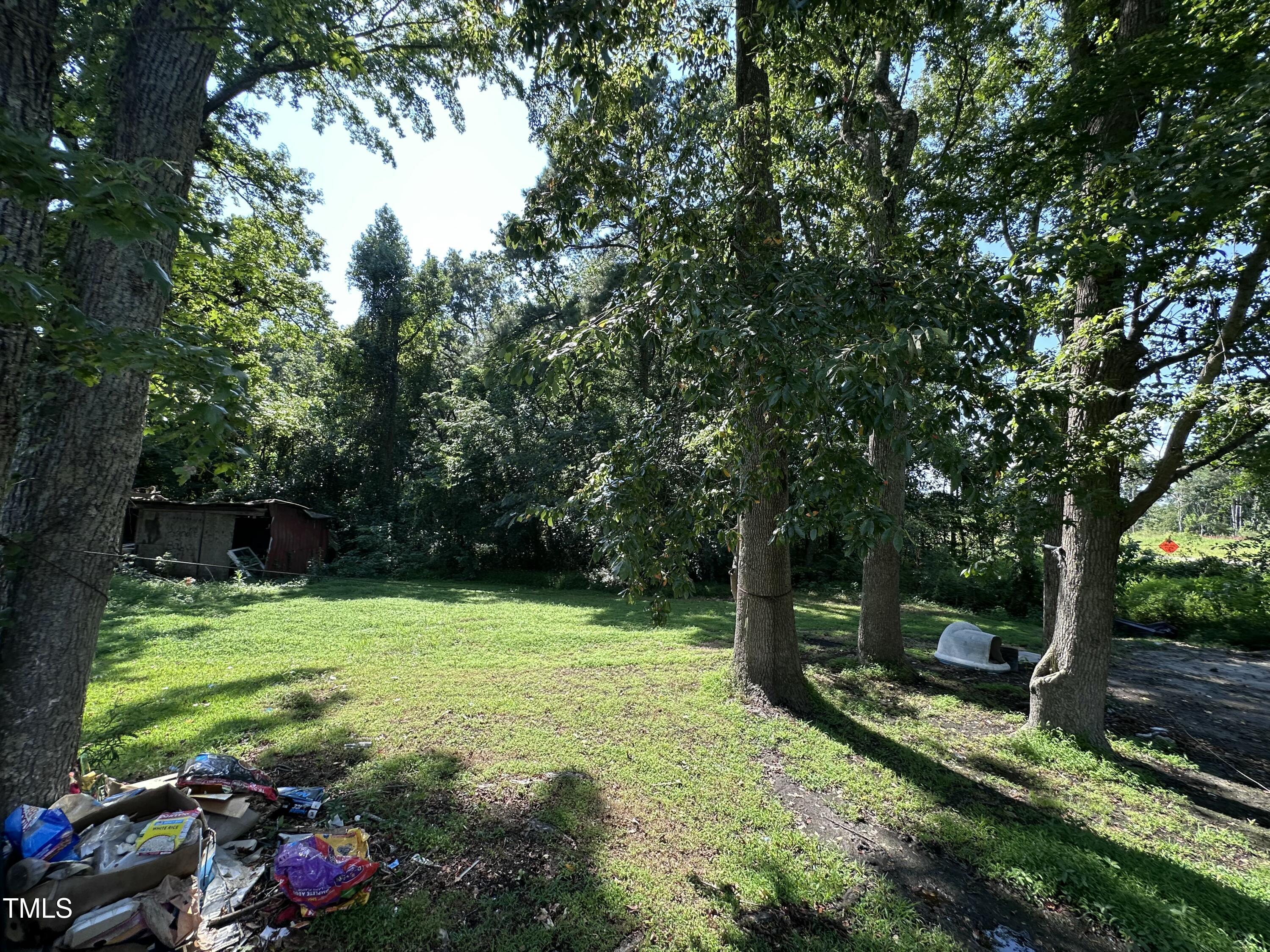 129 Spring Valley Road Henderson, NC 27536 - Photo 6 of 14 a view of a park with large trees