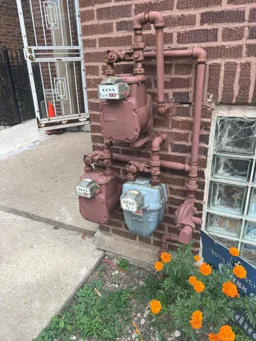 an outdoor room with fireplace