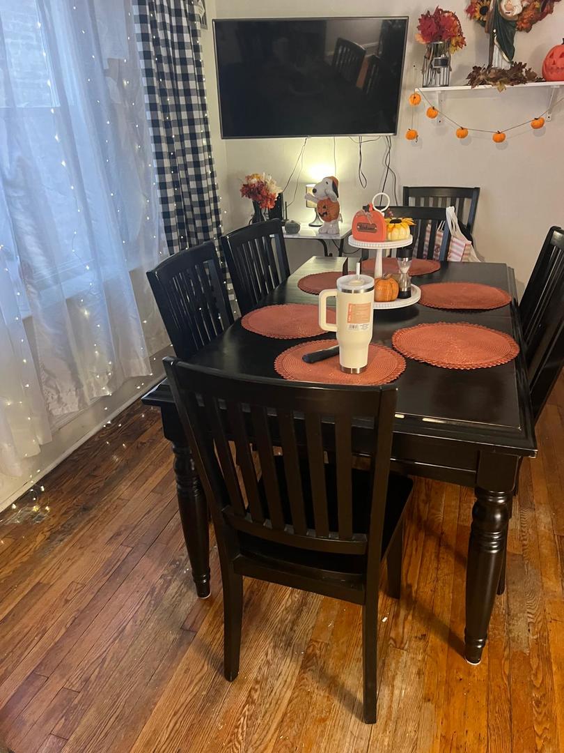 6155 South Whipple Street Chicago, IL 60629 - Photo 3 of 18 a view of a dining room with furniture and wooden floor