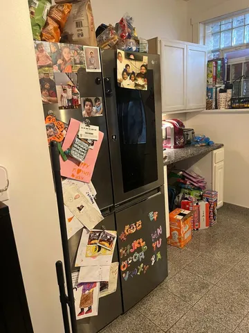 a storage room filled with furniture and a refrigerator