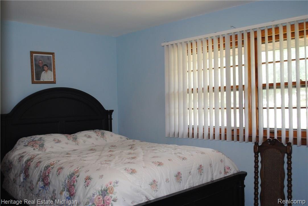 9124 Lee Road Brighton, MI 48116 - Photo 9 of 12 Master bedroom offers lots of light and plenty of room for your furniture!