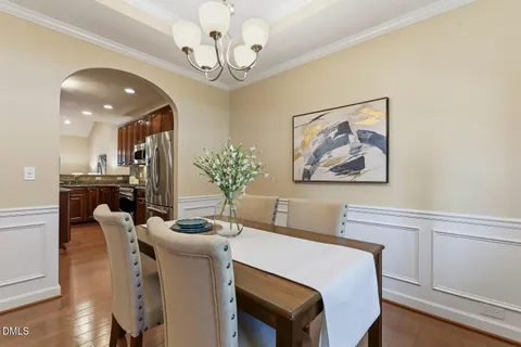 a kitchen with granite countertop wooden cabinets stainless steel appliances and a sink