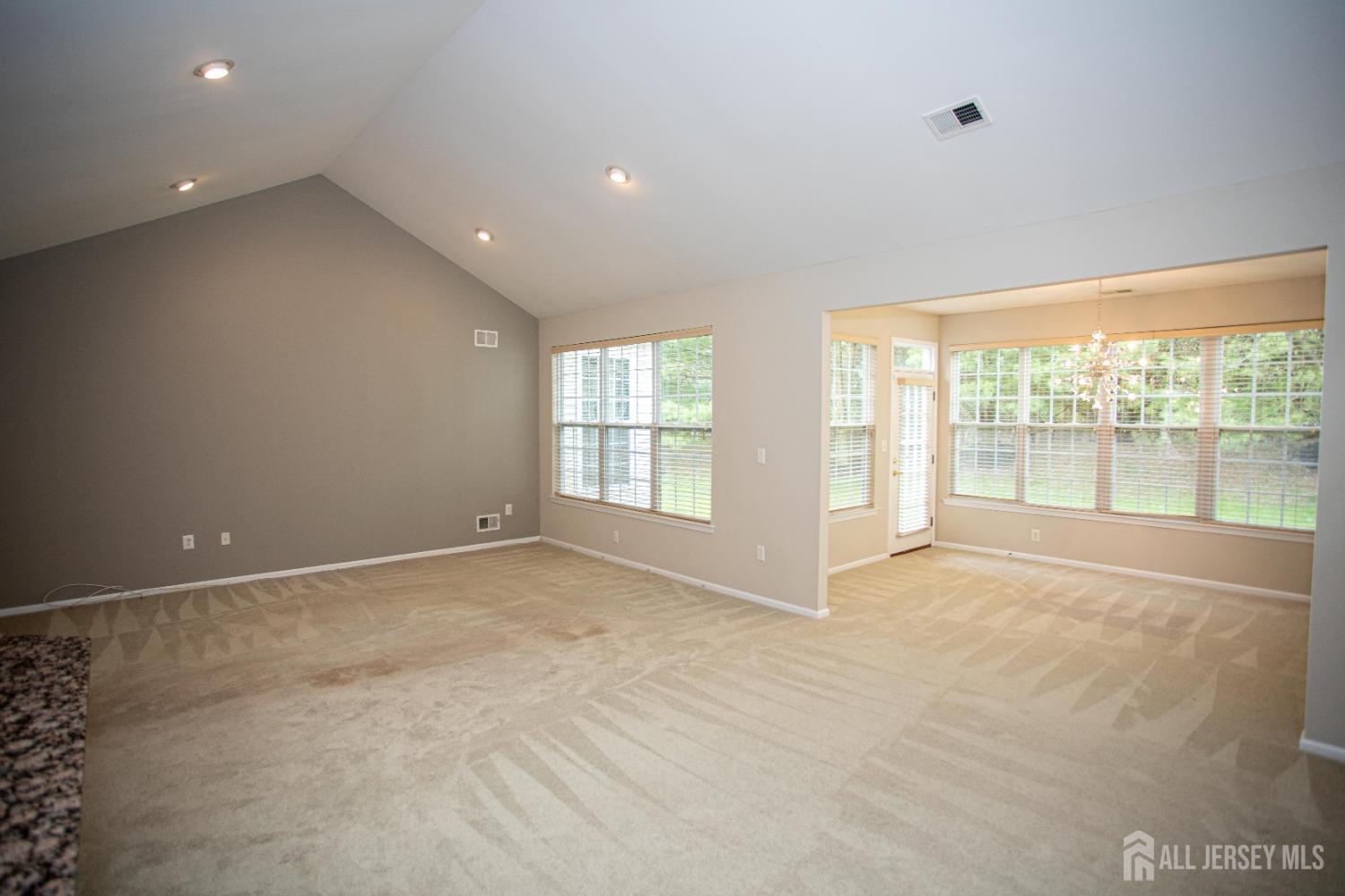 247 Spring Meadow Way Monroe Township, NJ 08831 - Photo 11 of 32 a view of an empty room with a window
