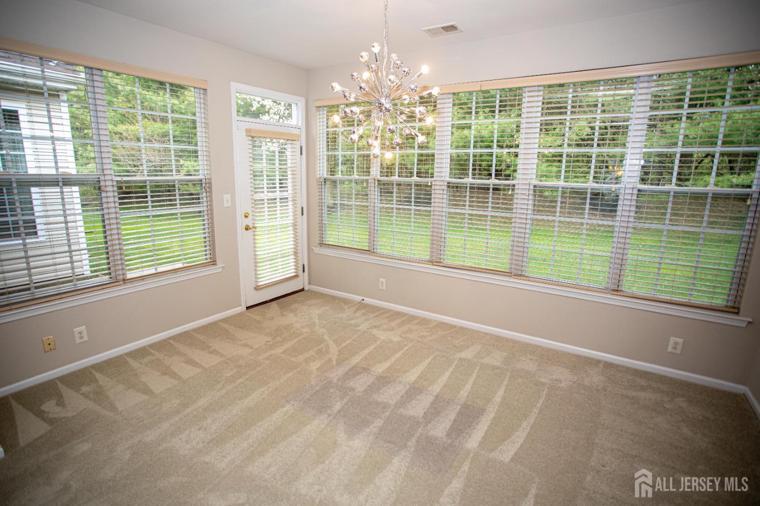 247 Spring Meadow Way Monroe Township, NJ 08831 - Photo 13 of 32 a view of a room with windows