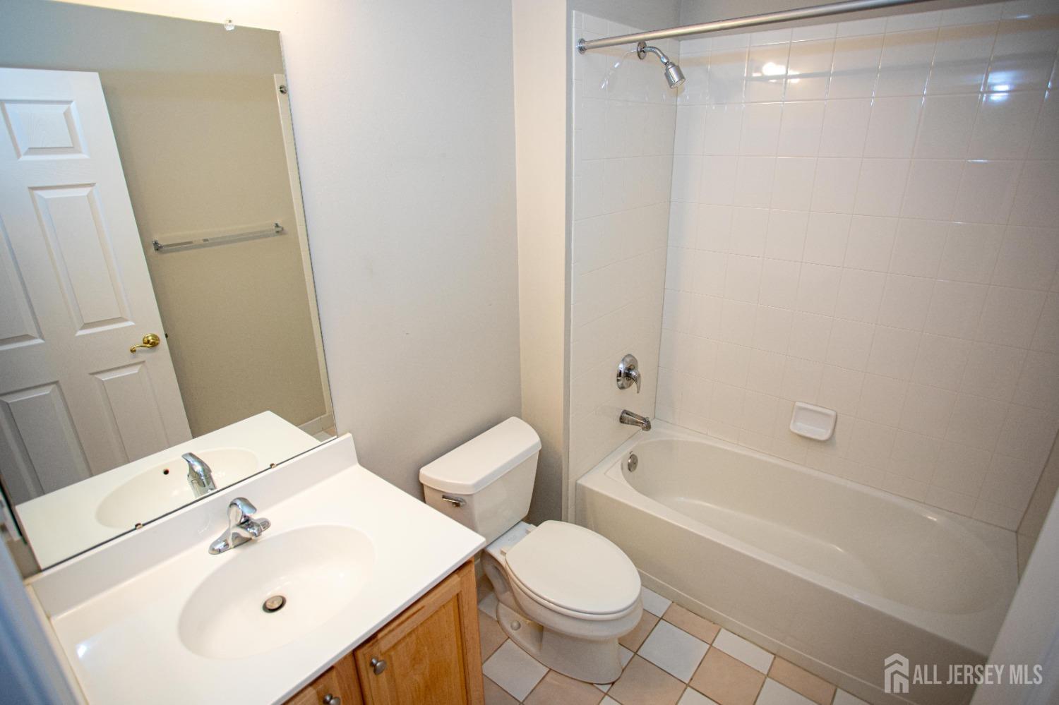 247 Spring Meadow Way Monroe Township, NJ 08831 - Photo 24 of 32 a bathroom with a sink toilet and shower