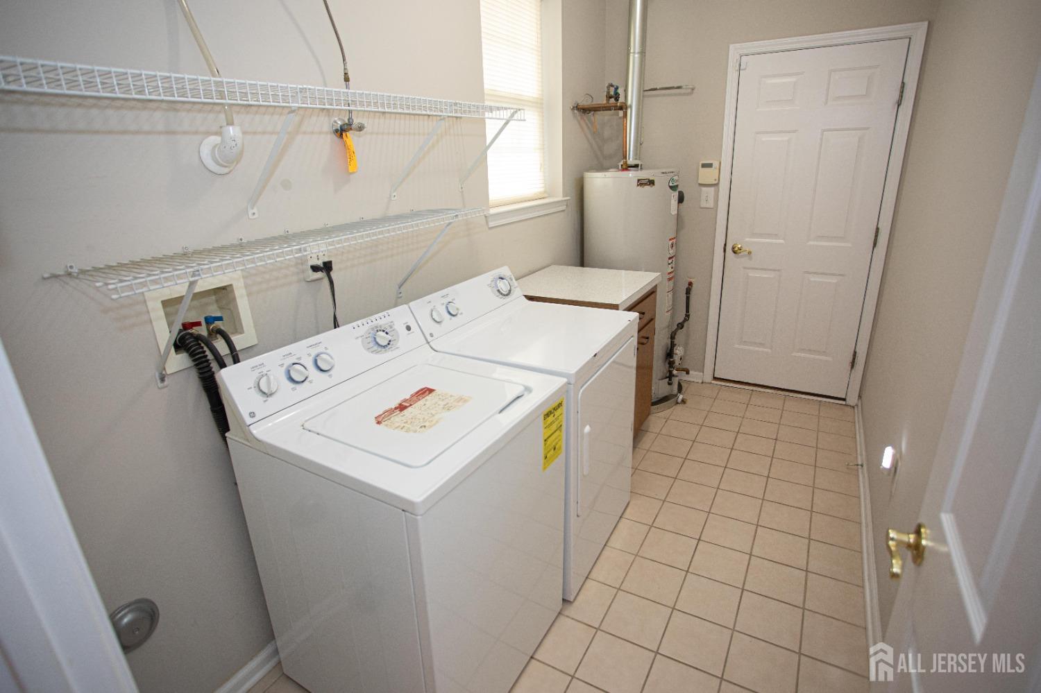 247 Spring Meadow Way Monroe Township, NJ 08831 - Photo 25 of 32 a utility room with dryer and washer