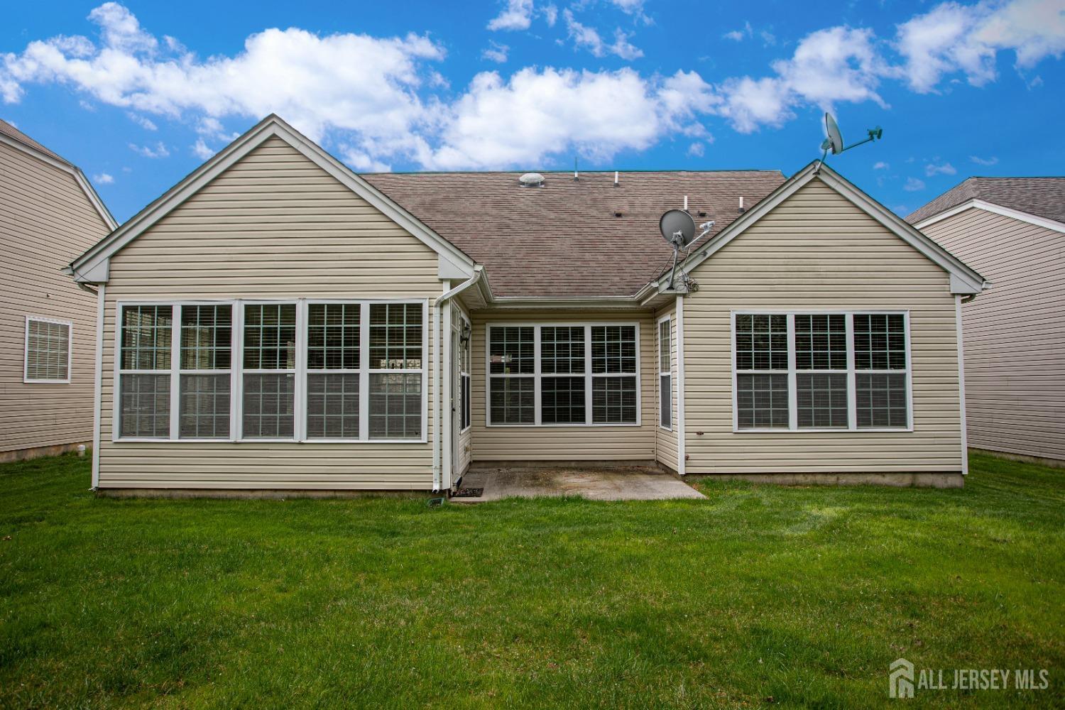 247 Spring Meadow Way Monroe Township, NJ 08831 - Photo 27 of 32 a view of front of a house with a yard