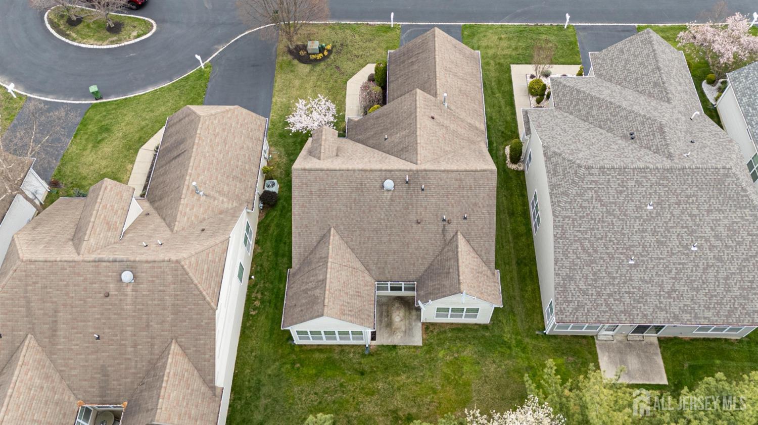 247 Spring Meadow Way Monroe Township, NJ 08831 - Photo 31 of 32 an aerial view of a house with a swimming pool and garden