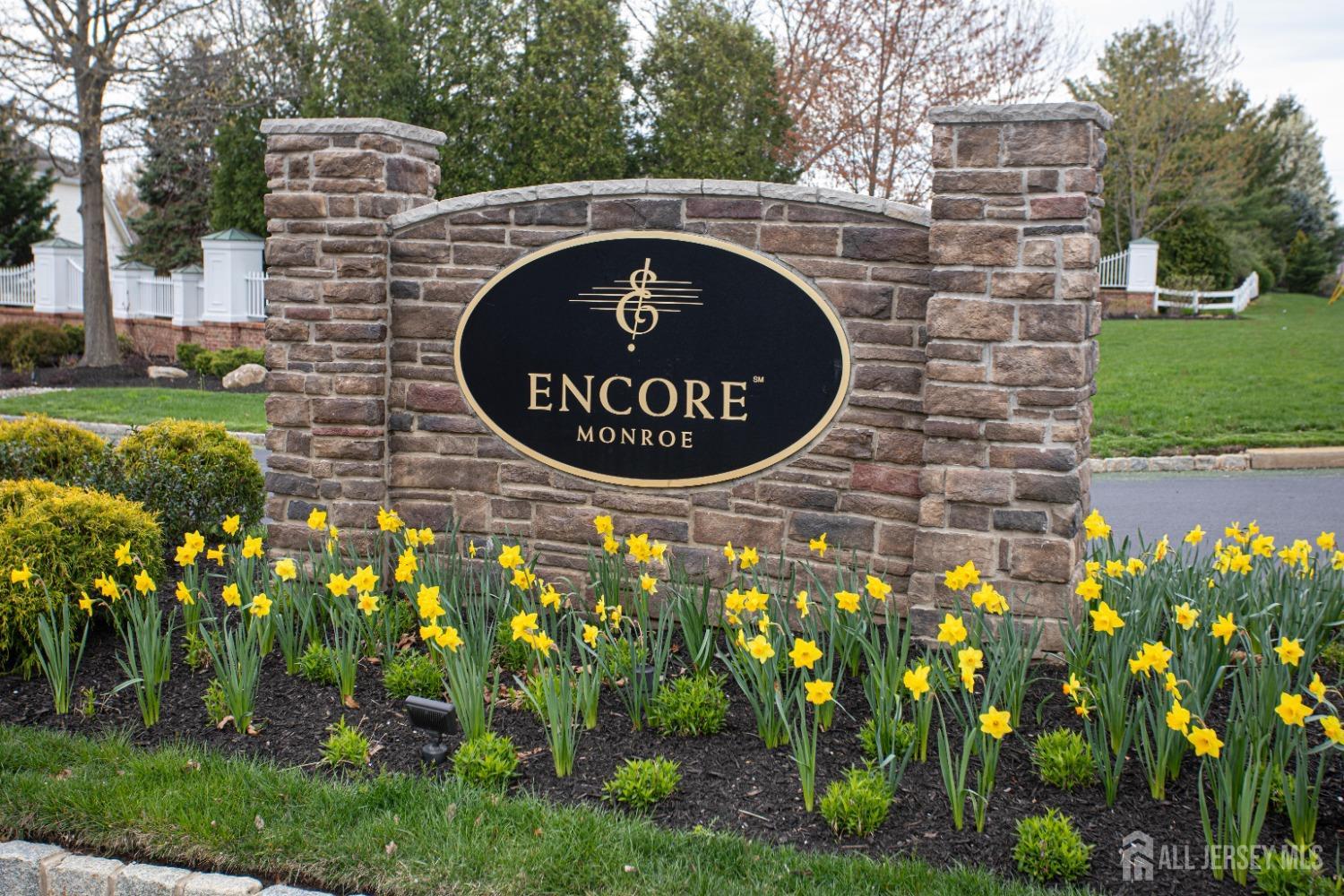 247 Spring Meadow Way Monroe Township, NJ 08831 - Photo 32 of 32 a front view of a house with garden