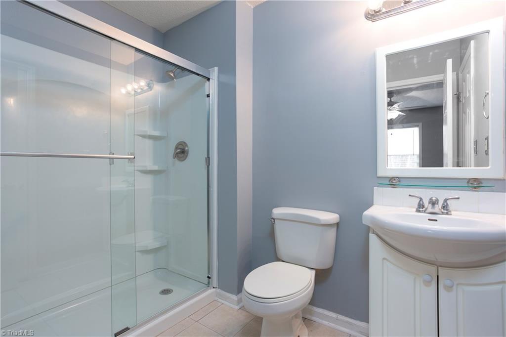 7325 Goodwill Church Road Oak Ridge, NC 27310 - Photo 12 of 20 Master Bathroom has a BRAND NEW walk in shower!