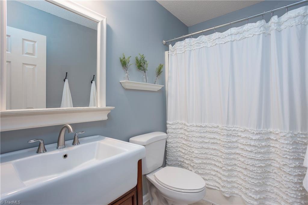 7325 Goodwill Church Road Oak Ridge, NC 27310 - Photo 13 of 20 Guest bath in the hallway. Look at that pretty farmhouse style sink!