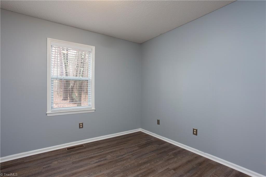 7325 Goodwill Church Road Oak Ridge, NC 27310 - Photo 16 of 20 Guest bedroom in the back with new vinyl plank flooring