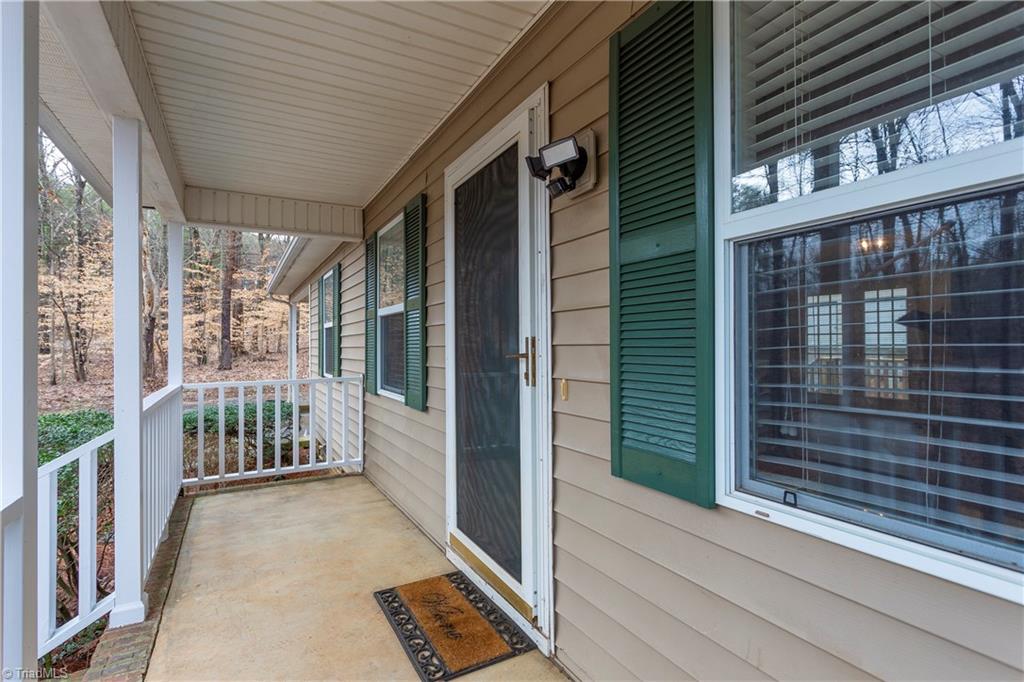 7325 Goodwill Church Road Oak Ridge, NC 27310 - Photo 4 of 20 Covered front porch perfect for rocking chairs