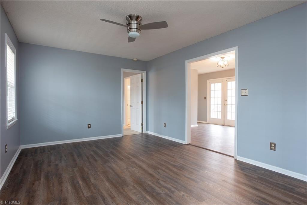 7325 Goodwill Church Road Oak Ridge, NC 27310 - Photo 5 of 20 Bright Living Room with brand new vinyl plank flooring