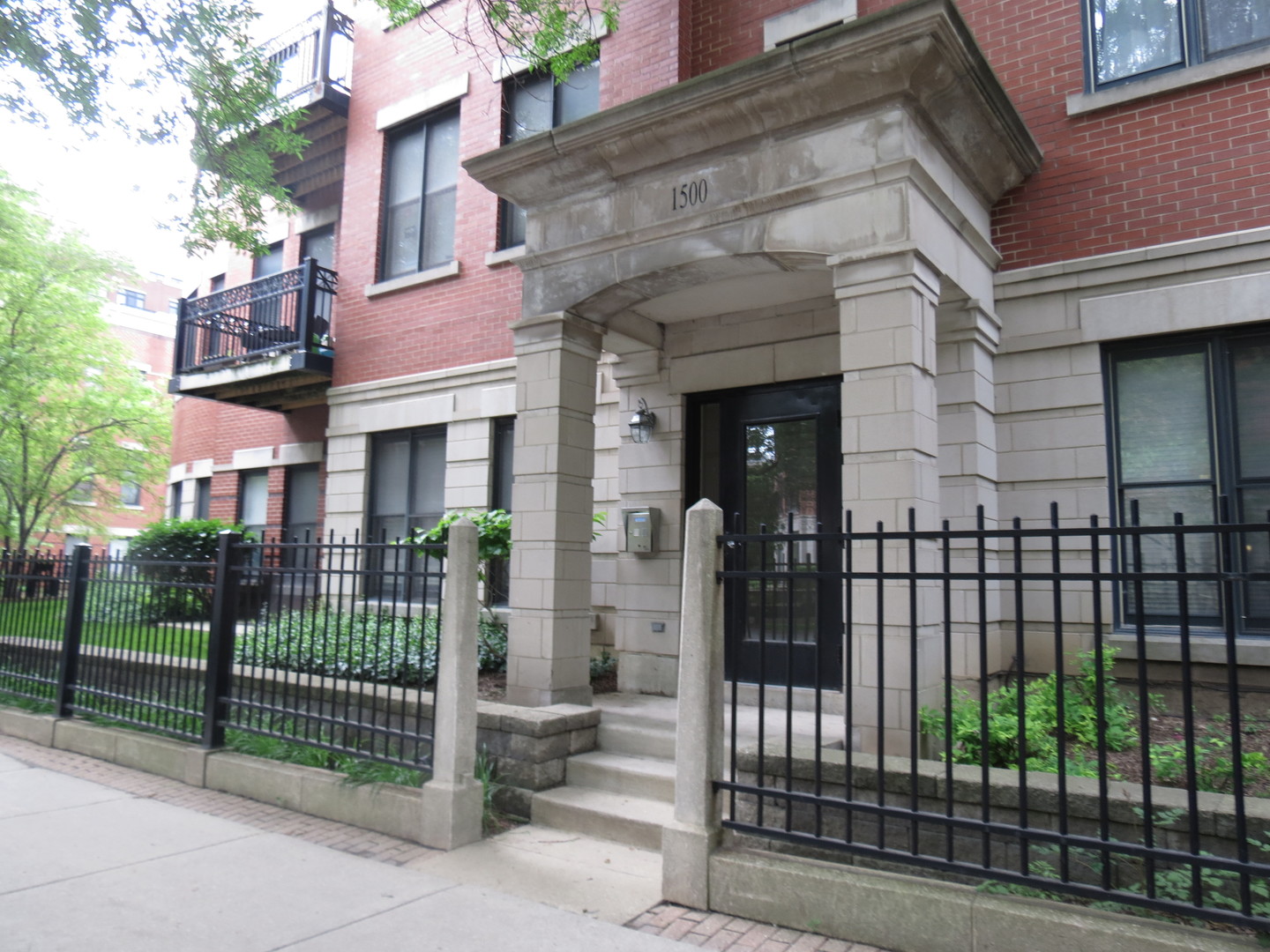 1500 South Halsted Street, Unit 3B Chicago, IL 60607 - Photo 30 of 33 front view of a brick house with a large windows