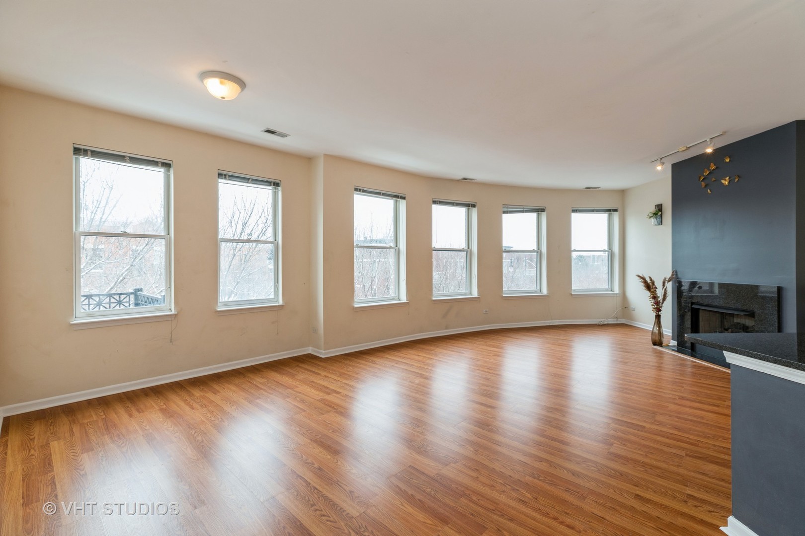 1500 South Halsted Street, Unit 3B Chicago, IL 60607 - Photo 6 of 33 a view of an empty room with glass door and wooden floor