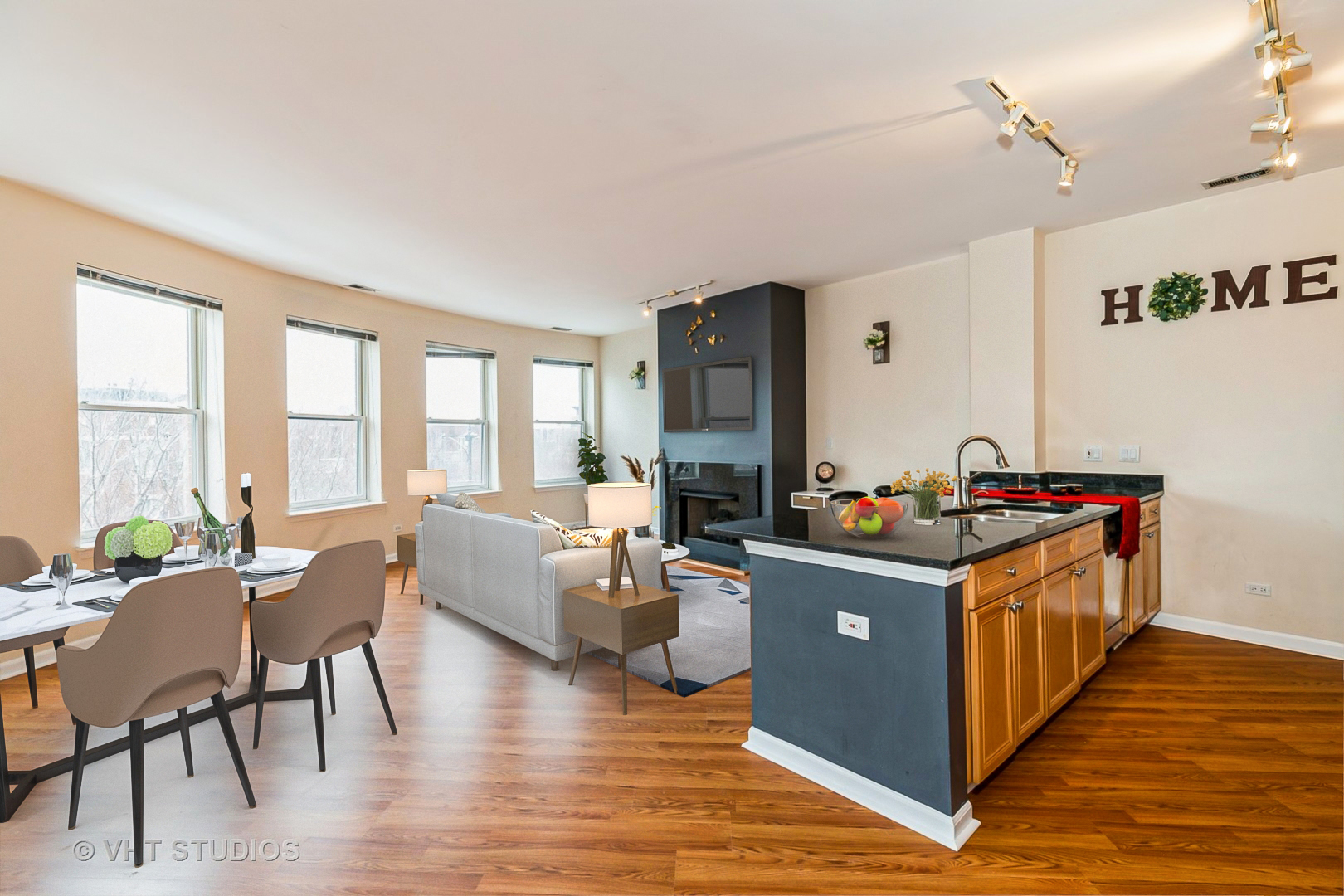 1500 South Halsted Street, Unit 3B Chicago, IL 60607 - Photo 9 of 33 a living room with furniture and a dining table with wooden floor
