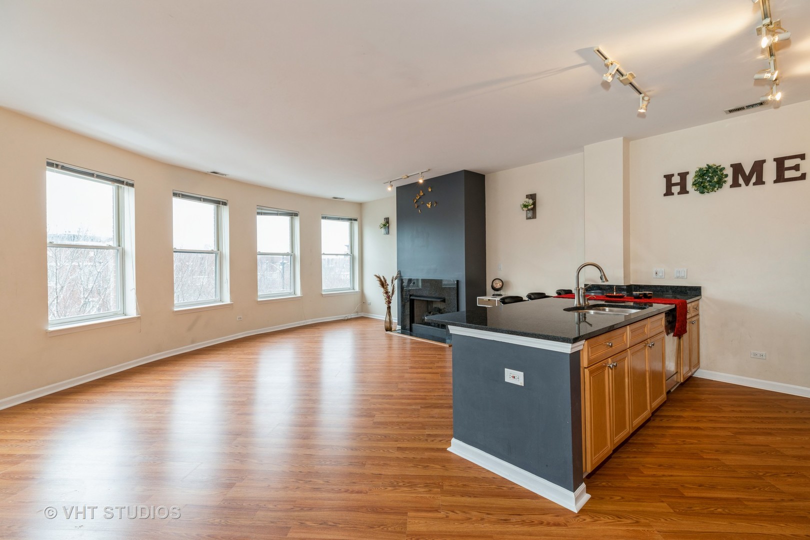 1500 South Halsted Street, Unit 3B Chicago, IL 60607 - Photo 10 of 33 a kitchen with stainless steel appliances granite countertop a stove and a large window