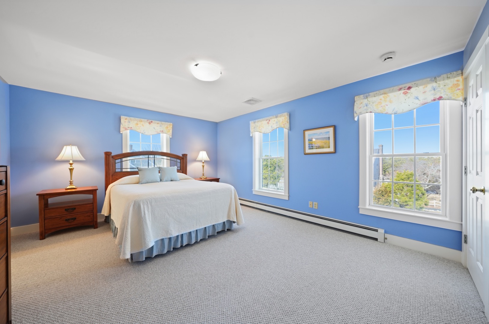 20 Rudder Lane Nantucket, MA 02554 - Photo 21 of 34 a spacious bedroom with a bed and a window