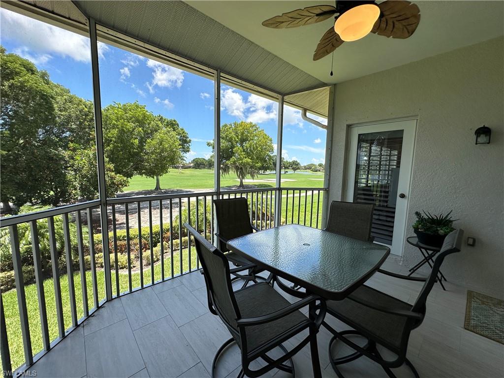 9113 Michael Circle, Unit 7710 Naples, FL 34113 - Photo 11 of 34 a view of a balcony with table and chairs