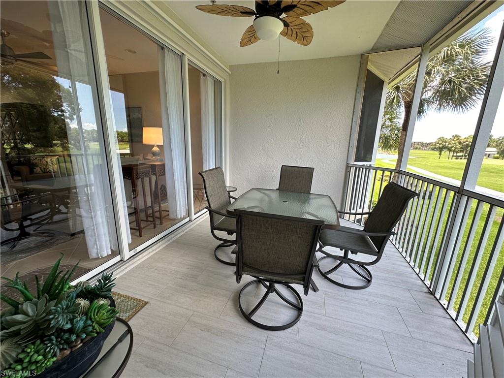 9113 Michael Circle, Unit 7710 Naples, FL 34113 - Photo 9 of 34 a view of a porch with chairs and backyard