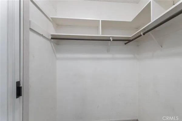 a view of an empty walk in closet