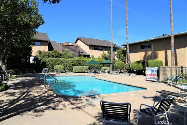 a view of a backyard with sitting area