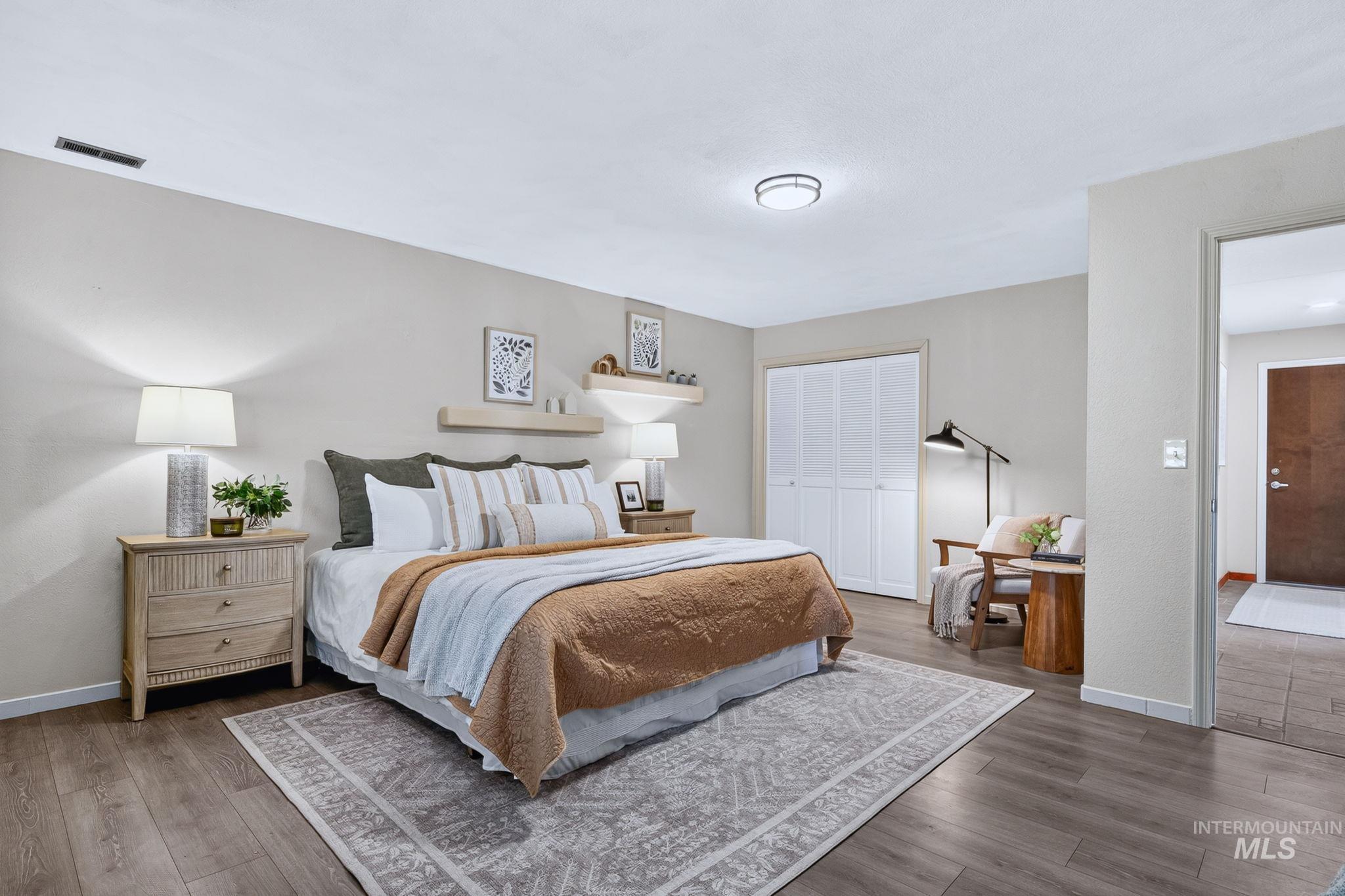 1750 East Shaw Mountain Road Boise, ID 83712 - Photo 31 of 47 Spacious bedroom featuring wood-finish flooring, neutral paint palette, and a ceiling-mounted light fixture